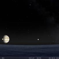 Взгляд на Юпитер с поверхности Ганимеда. Через диск Юпитера в данный момент проходит Ио, справа ещё один спутник - Каллисто. Планетарий в компьютере: http://u.to/ZZHQAg