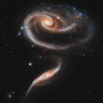Arp 273 - группа взаимодействующих галактик в созвездии Андромеды, находящаяся на растоянии 300 млн. световых лет от Земли.